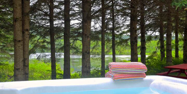 Private jacuzzi chalet to rent front off river available year round fully equipped