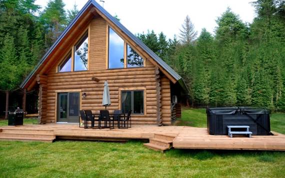 Chalet vacances en bois ronds au bord de la rivière Saint-Maurice avec spa privé en location pour 2 à 4 personnes tout équipé Chalets Booking Domaine McCormick